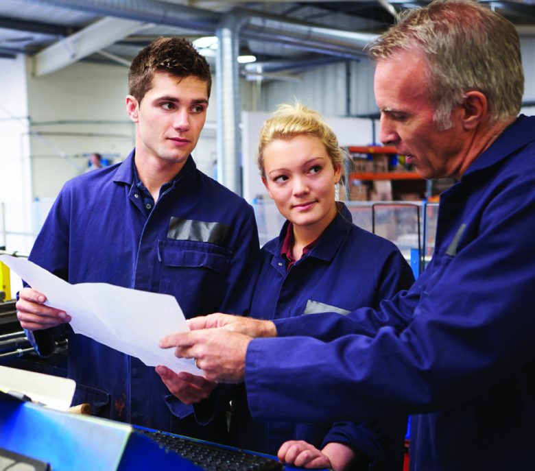 A group of workers engaged in hands-on safety training