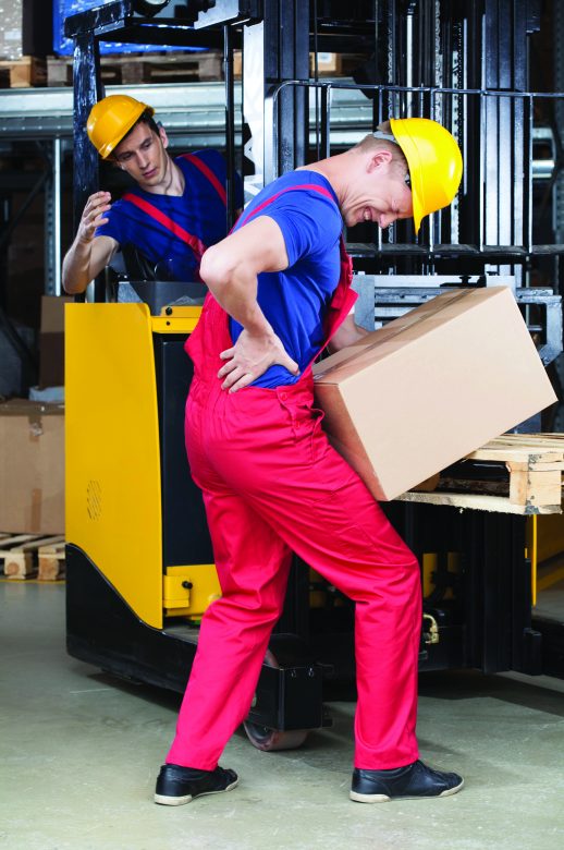 A worker hurts his back on the job while manually carrying a box