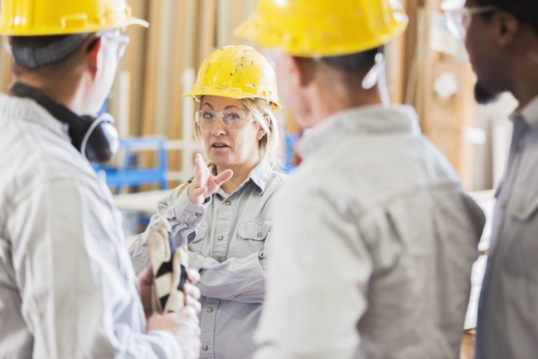 Woman delivering a safety talk on a construction site