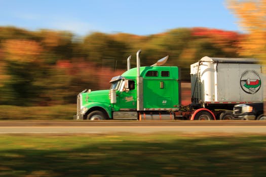 Tractor-trailer speeding down the road