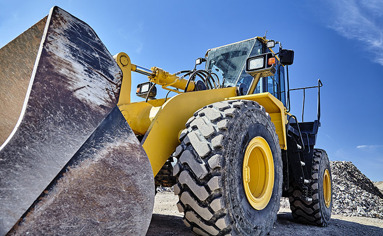 Heavy equipment machine wheel loader on construction jobsite