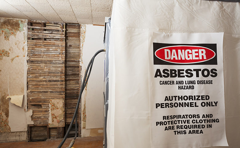 Asbestos Warning Danger Sign on a Decontamination Chamber