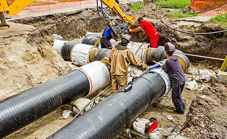 Team of contractors on building new pipeline