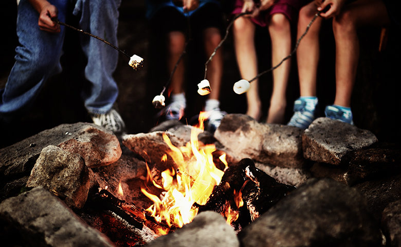 Roasting marshmallows around the campfire