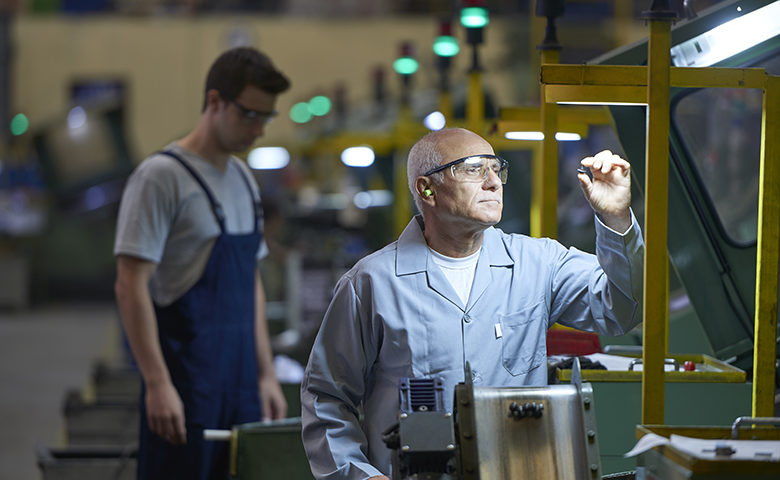 Worker looking at product in bolt factory