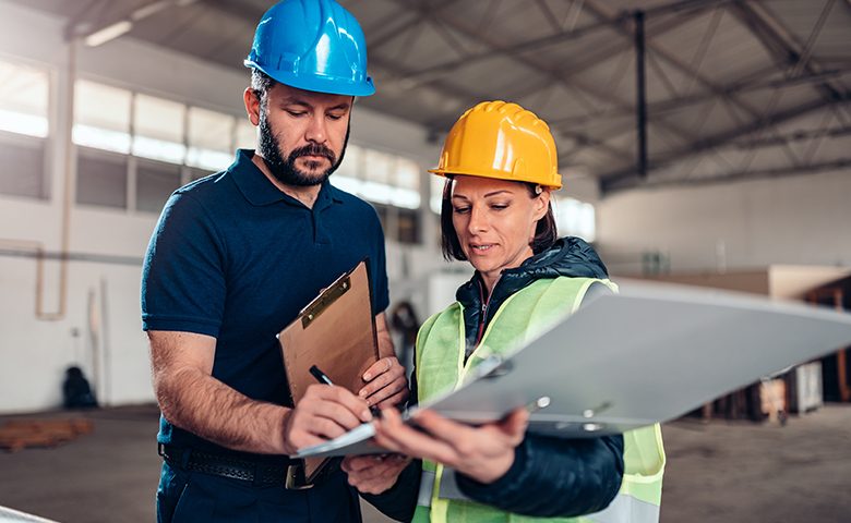 Safety prodessional signing documents in warehouse