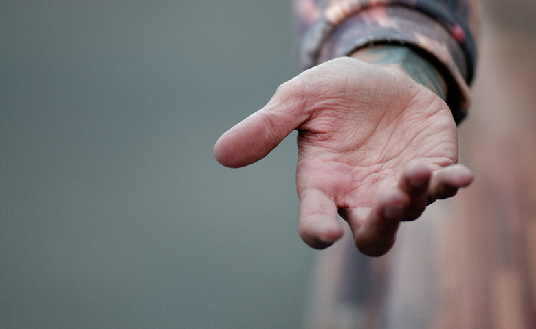 Man hand extended to help